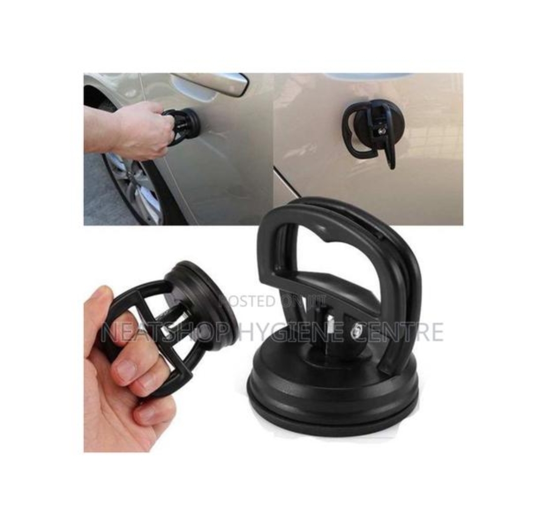 Car dent puller removing dent